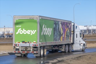 Calgary, Alberta, Canada. Feb 19, 2024. A Sobeys semi-truck trailer delivering food supplies to a