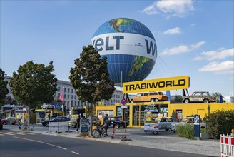 A picture of the TrabiWorld Berlin and the Welt Balloon