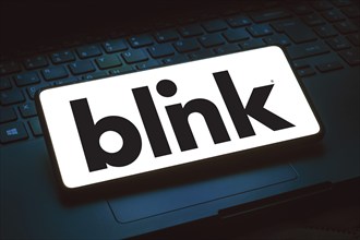 In this photo illustration, the Blink Charging logo is displayed on a smartphone screen