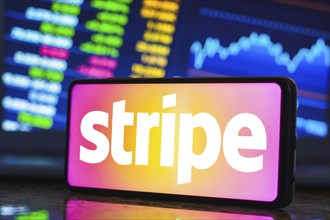 In this photo illustration, the Stripe logo is displayed on a smartphone screen