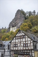 An old half-timbered town in autumn. A church was built into a rock here. Unique German