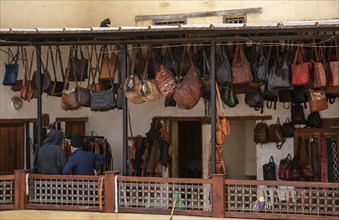 A typical leather shop on the roof of a tannery in the medina of Fes, Morocco, Africa