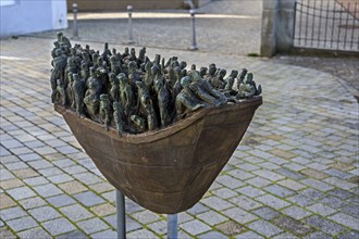 Figures in a boat, bronze artwork at the former collegiate church of St Peter, a Roman Catholic