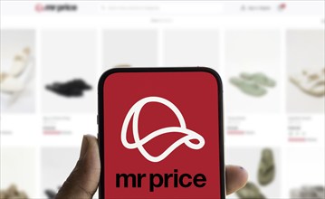 Mr Price logo is displayed on smartphone. Mr Price Group ltd is a cash based fashion value retailer