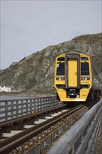 BARMOUTH, GWYNEDD UK, APRIL 09 : Train travelling over the viaduct in Barmouth, Gwynedd on April