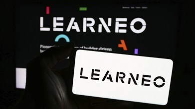 Stuttgart, Germany, 04-02-2024: Person holding smartphone with logo of US education platform