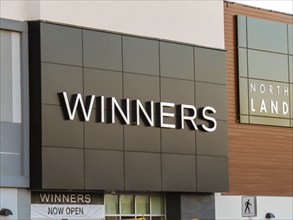 Calgary, Alberta, Canada. Oct 8, 2023. A Winners store sign, a chain of off-price Canadian