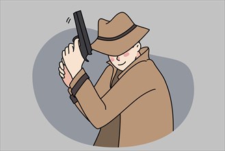 Male detective in coat and hat holding gun spying for criminal or suspect. Man spy or police