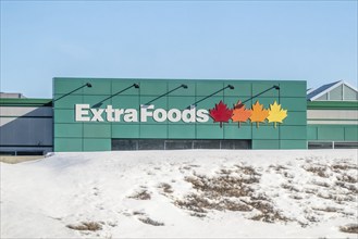 Drumheller, Alberta, Canada. Feb 19, 2024. An Extra Foods sign groceries store. A chain of