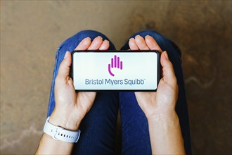 In this photo illustration, the Bristol Myers Squibb (BMS) logo is displayed on a smartphone screen