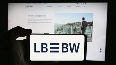 Stuttgart, Germany, 07-15-2024: Person holding cellphone with logo of German company Landesbank