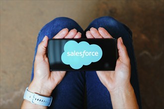 In this photo illustration, the Salesforce logo is displayed on a smartphone screen