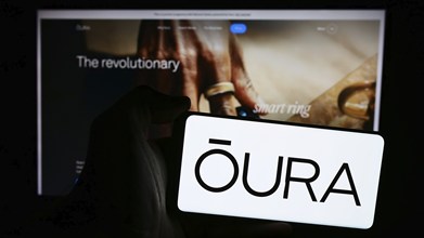 Stuttgart, Germany, 07-11-2024: Person holding mobile phone with logo of Finnish health technology