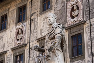 Rich ornate facade of the Palazzo della Carovana in the center of Pisa, Italy, Europe