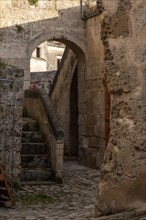 Abandoned alley with staircase in the historic downtown of Matera, Italy, Europe