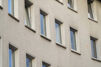 Rows of windows on an older residential building