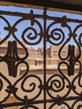 Ornate traditional window grid of a berber house ruin in the city center of Amezrou, Morocco,