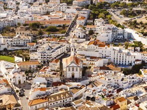 Aerial View of residential houses and Mother Church in Albufeira, Algarve, Portugal, Europe