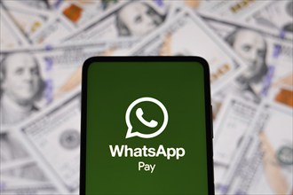 In this photo illustration the WhatsApp Pay logo seen displayed on a smartphone