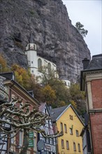 An old half-timbered town in autumn. A church was built into a rock here. Unique German