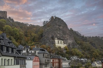 An old half-timbered town in autumn. A church was built into a rock here. Unique German