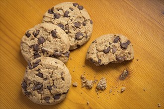 Chocolate chip cookies on wood background