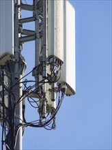 Detail of cell tower antennas and wiring, highlighting the metal structure