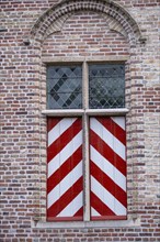 Medieval window on a house wall