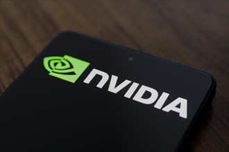 In this photo illustration, the Nvidia Corporation logo is displayed on a smartphone screen