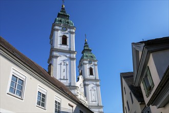 The two towers of the former collegiate church of St Peter, a Roman Catholic parish church, Bad