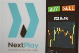 In this photo illustration the stock market graphic seen on a smartphone with the NextPlay