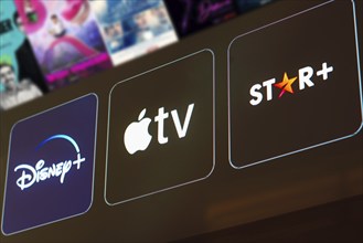 In this photo illustration the Disney Plus, Apple TV and Star Plus logo is displayed on a TV screen