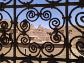 Ornate traditional window grid of a berber house ruin in the city center of Amezrou, Morocco,