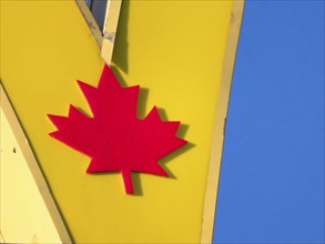 Calgary, Alberta, Canada. Oct 8, 2023. A close up to a Canadian maple leaf of a McDonalds fast food