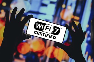 In this photo illustration, the Wi-Fi 7 logo is displayed on a smartphone screen