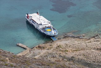 A picture of a ferry docked at Gramvousa Island