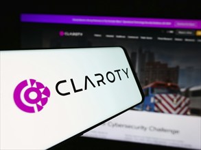 Stuttgart, Germany, 07-11-2024: Cellphone with logo of cybersecurity company Claroty Ltd. in front