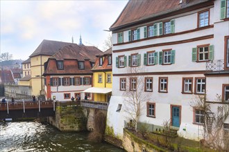 Bamberg, Germany, Ferbuary 19, 2017: Bamberg city center street view with houses and bridge over