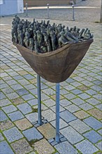 Figures in a boat, bronze artwork at the former collegiate church of St Peter, a Roman Catholic