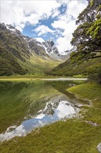 Tranquil mountain lake Mackenzie at the famous Routeburn Track, Fiordland National Park, South