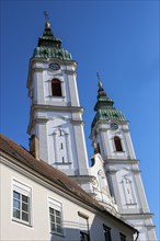 The two towers of the former collegiate church of St Peter, a Roman Catholic parish church, Bad