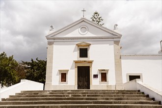 Small Chapel with cloudy sky in the background, Albufeira, Algarve, Portugal, Europe