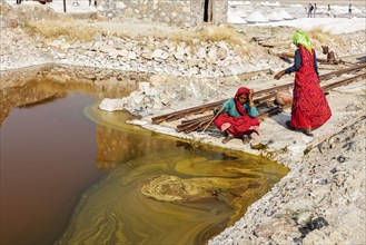 SAMBHAR, INDIA, NOVEMBER 19, 2012: Women mining salt at lake Sambhar, Rajasthan, India. Sambhar