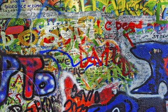 PRAGUE, CZECH REPUBLIC, APRIL 28, 2012: Lennon Wall is filled with John Lennon-inspired graffiti