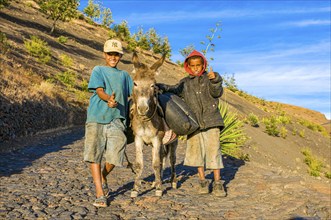 Children with donkey on path. Fogo. Cabo Verde. Africa