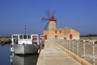 Windmill and boat at the salt pans of Mozia near Marsala, Sicily, Italy, Europe