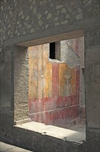 Villa of Poppea, view through window of the remains of the fresco decoration. Historic town of