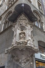 Madonna figure under a canopy on a corner house in the historic centre, Genoa, Italy, Europe