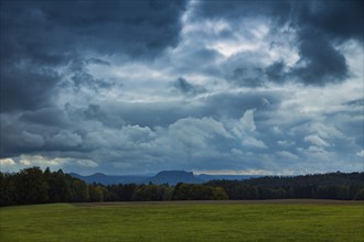 Dark clouds over the Lilienstein in Saxon Switzerland in the Basteige area