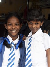 Sinhalese schoolgirls with white-blue clothes, ties, pigtails with blue ribbons, Sri Lanka, Asia